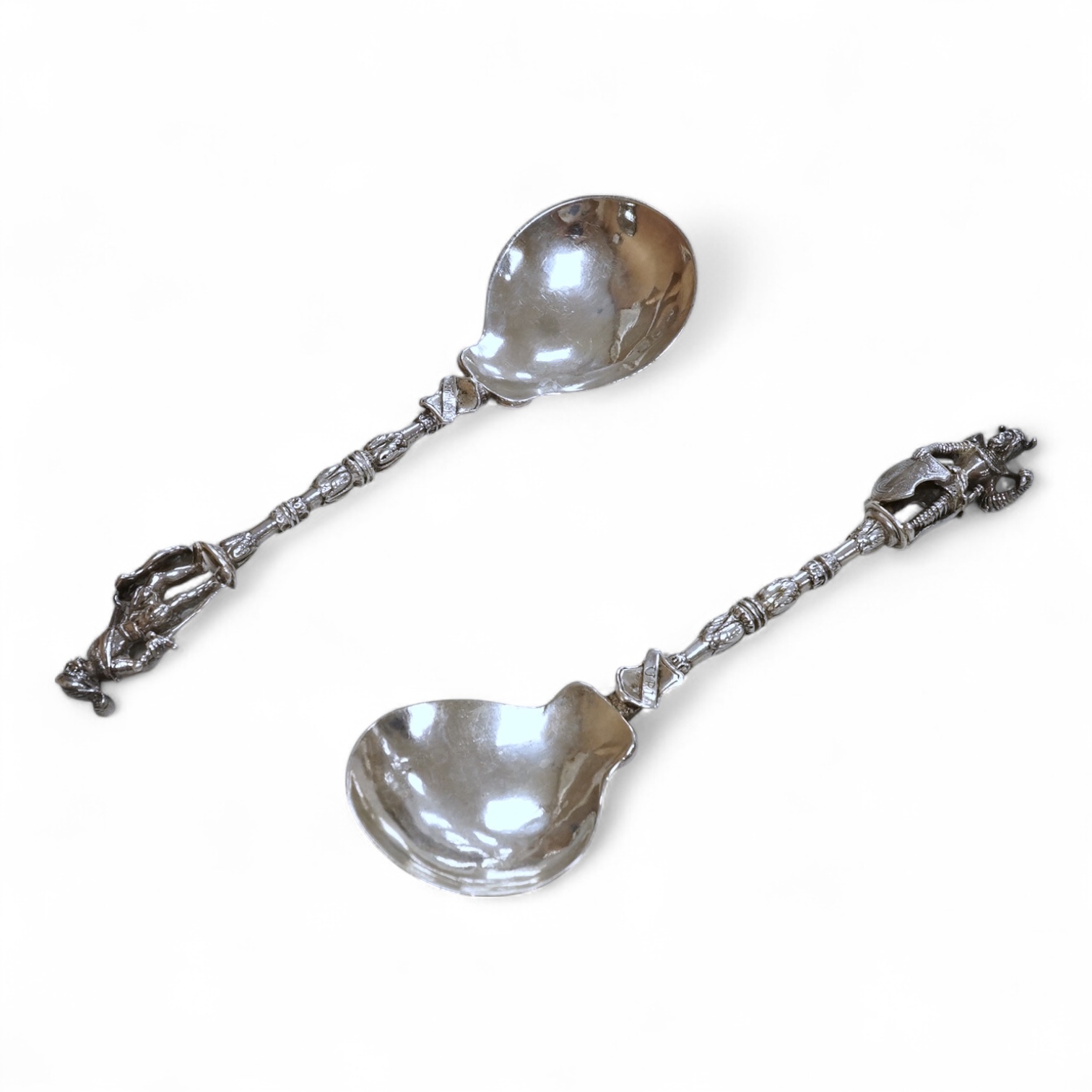 A pair of late 19th century Hanau silver spoons, with warrior finials, import marks for John George Smith, London, 1898, 18.6cm, 5oz.